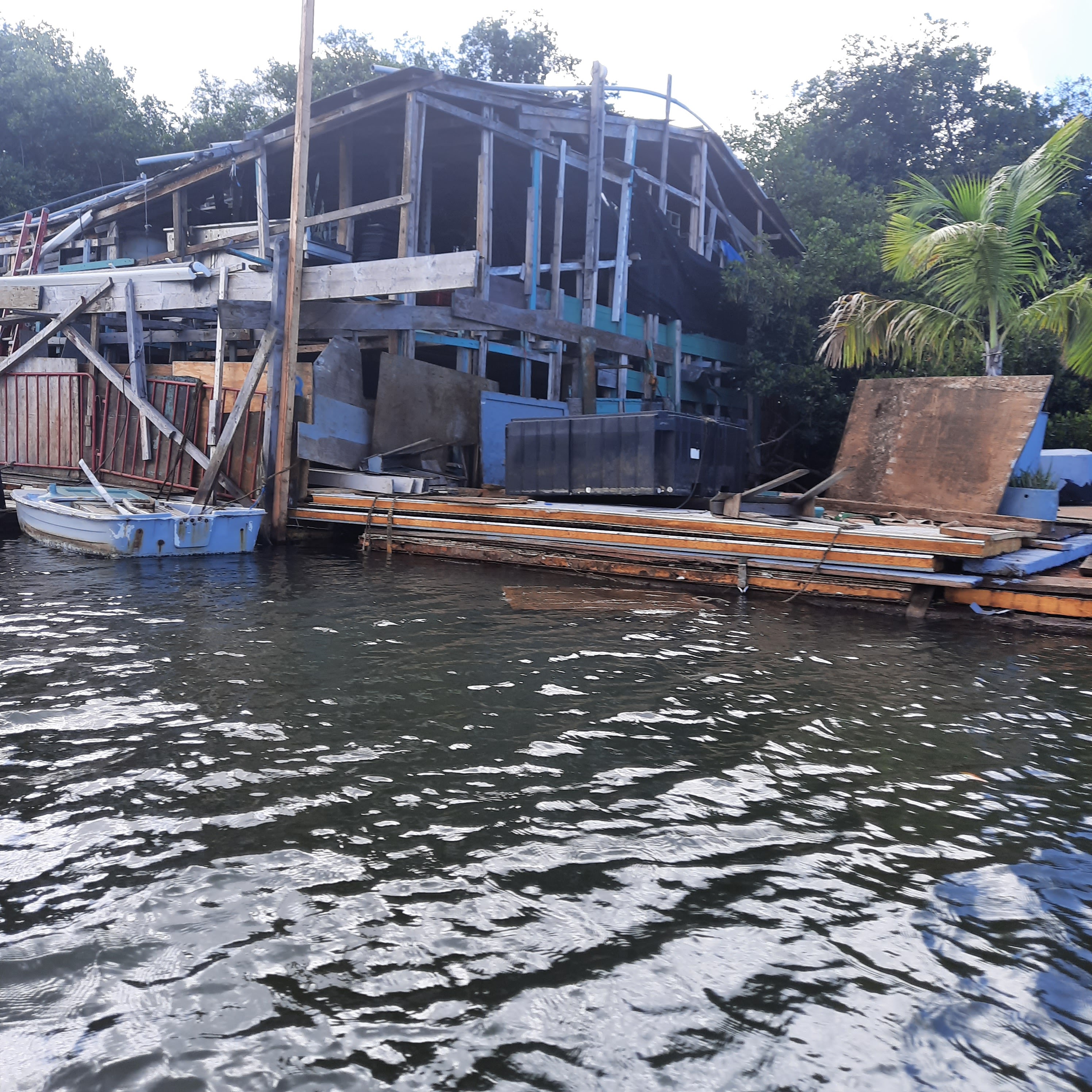 The floating home from the water before the walk-in extension was added