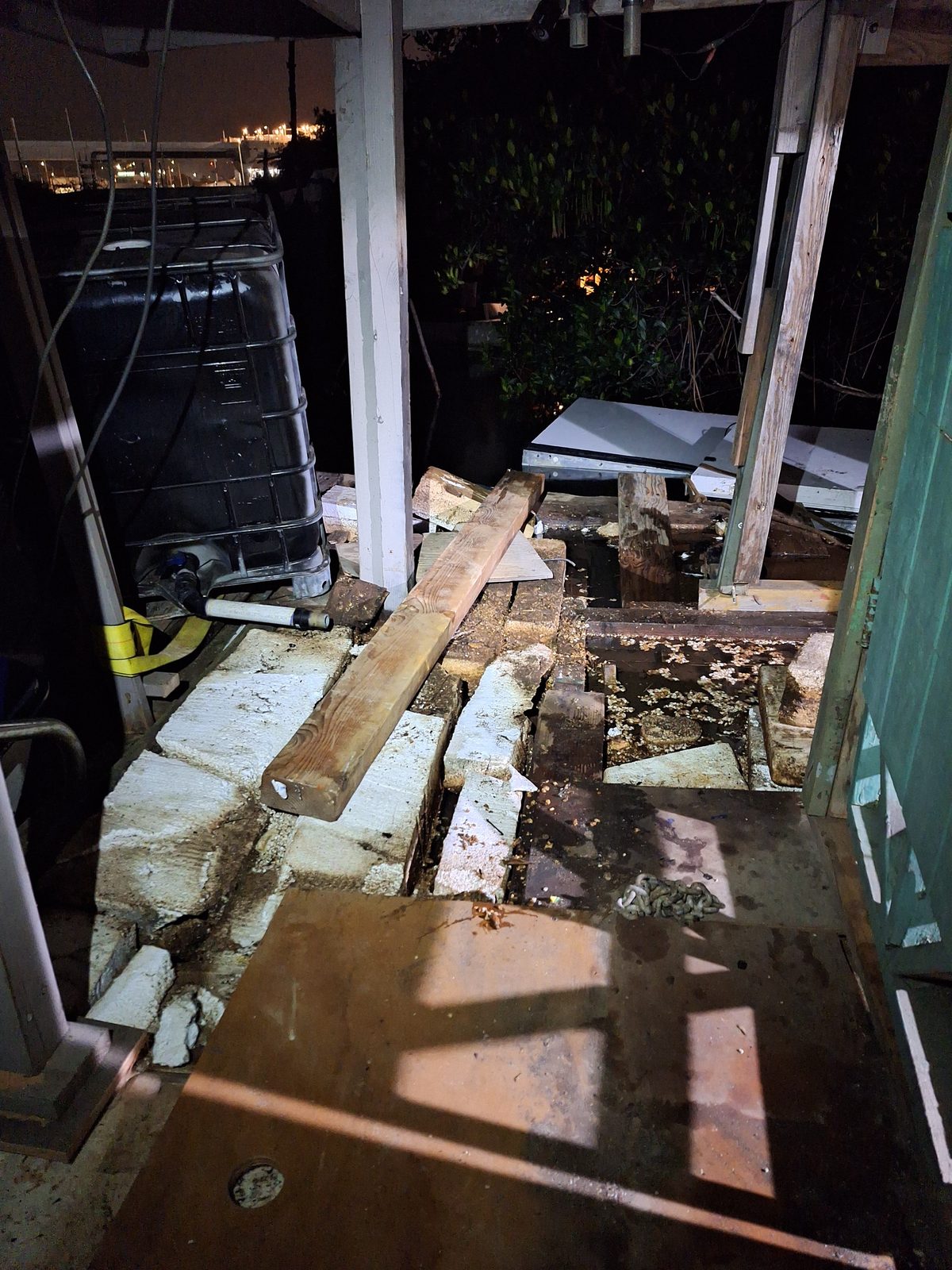 Dock and base area at night with construction lumber